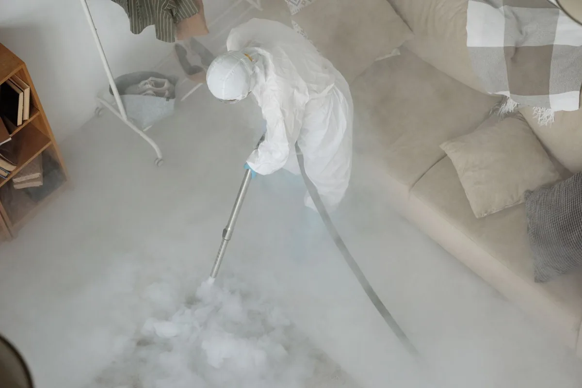Biohazard cleanup technician in protective equipment, Fairhill, Philadelphia, PA